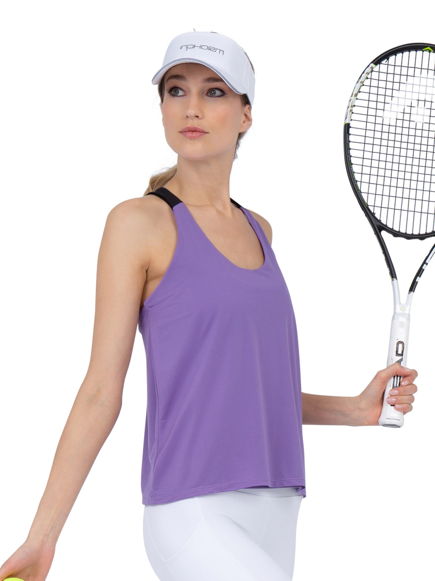 Front view of model wearing the double layer "T" racer back Camilla tank in lavender and black by inPhorm NYC holding a tennis racket