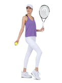 Front view of model wearing the double layer "T" racer back Camilla tank in lavender and black by inPhorm NYC holding a tennis ball and a racket