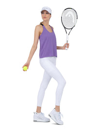 Front view of model wearing the double layer "T" racer back Camilla tank in lavender and black by inPhorm NYC holding a tennis ball and a racket