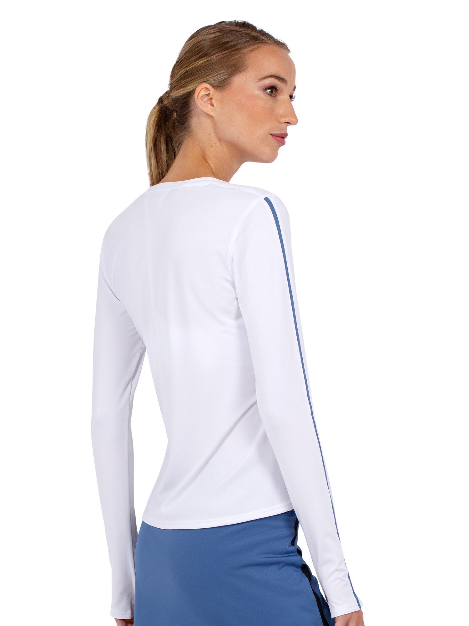 Back view of model wearing the classic long sleeve crew in palladian and white by inPhorm NYC with one hand on her shoulder