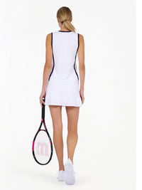 Back view of model wearing the Hazel tank in white and ink by inPhorm NYC holding a tennis racket