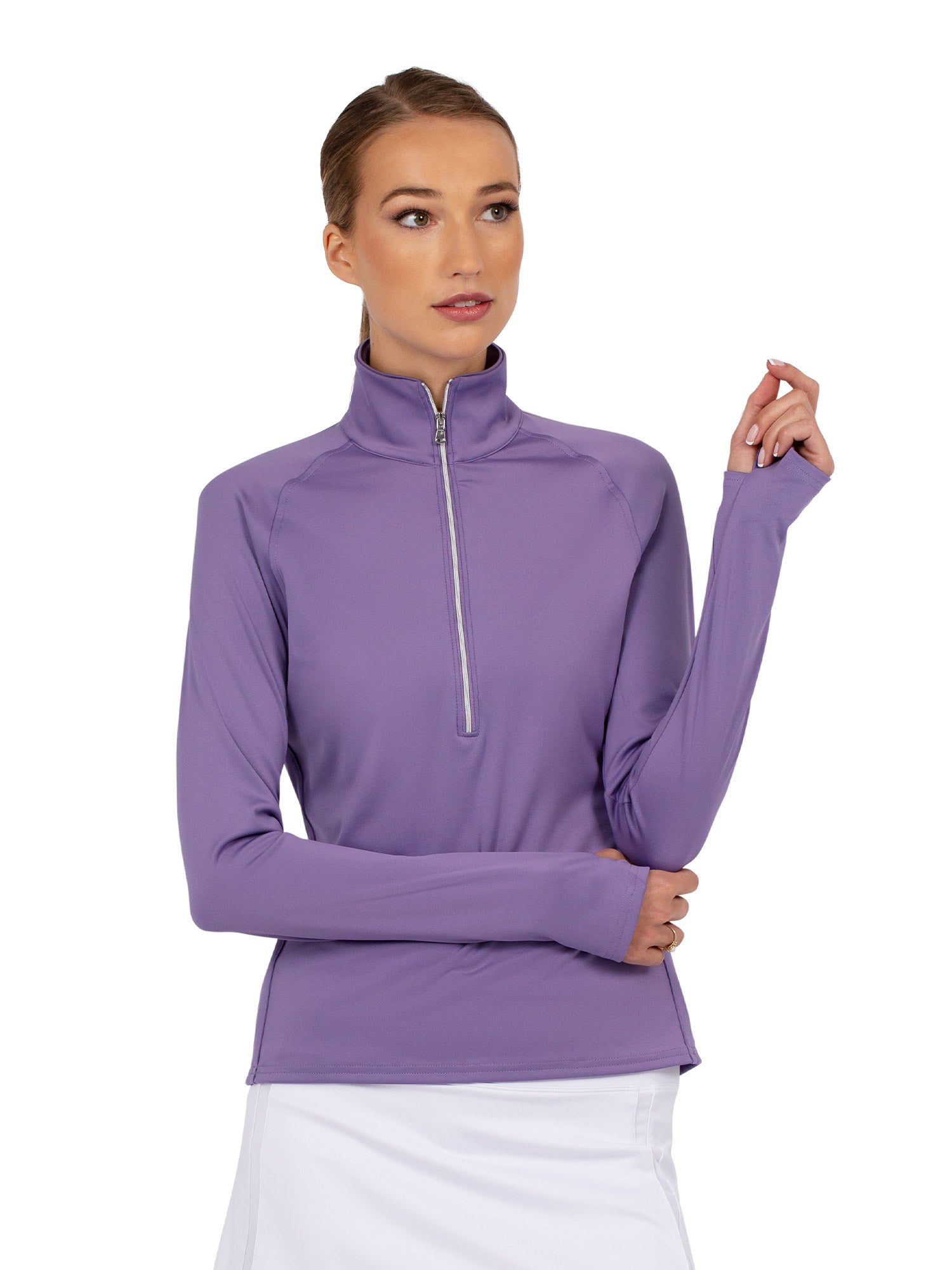 Front view of model wearing the performance zone half zip in lavender by inPhorm NYC with one hand on her elbow