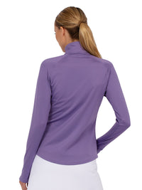 Back view of model wearing the performance zone half zip in lavender by inPhorm NYC with one hand at her side