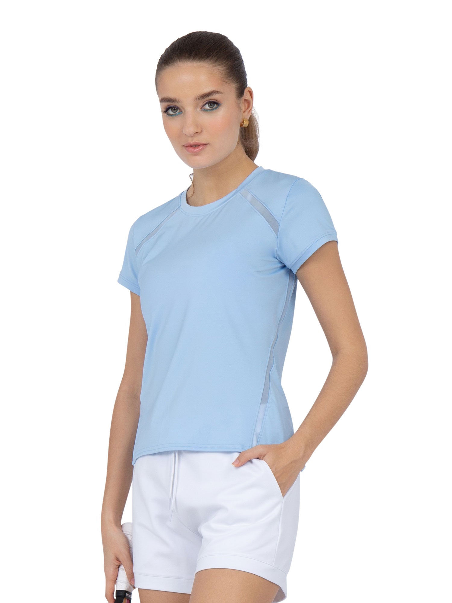 Front view of model wearing the classic short sleeve crew neck in bluebell by inPhorm NYC with one hand in her pocket